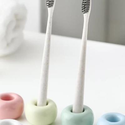 China Sustainable Ceramic Toothbrush Holder Macaron Fashion Couple Toothbrush Holder for sale