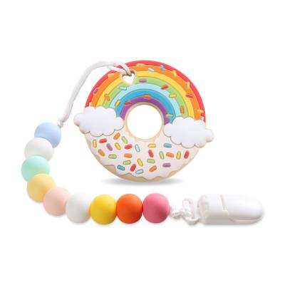 China New Arrival Safety Christmas Rainbow Donut Silicone Baby Chewable Teething Toys Sensory Teethers for sale