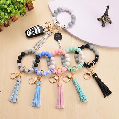 China New car key chain design silicone alphabet love letter tassel design bracelet car locks key chain for sale