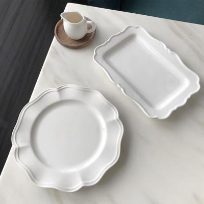 China Viable Wholesale Cheap Ceramic White Ceramic Dinner Dish Dessert Dish With Wave Edge for sale