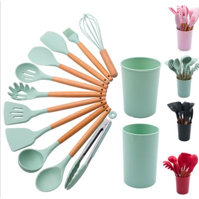 China Sustainable Cookware Sets 12 Pcs Silicone Heat Resistant Cookware Wood Handle Kitchen Utensils for sale