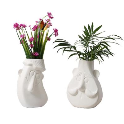 China Nordic Ceramic White Abstract Vase Decorative Art Decor Ins Flower Vase For Home Decor for sale