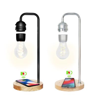 China Creative Unique Hanging Gift Led Hanging Night Light Bulb Phone Smart Wireless Charger Magnetic Levitating Lamp for sale