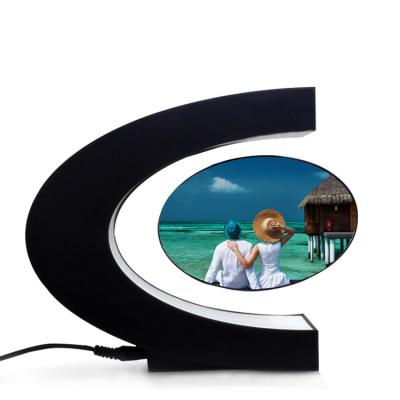 China Global View Acrylic C Shaped Children Photo Magnetic Levitation Decorative Desktop Arts and Crafts for sale