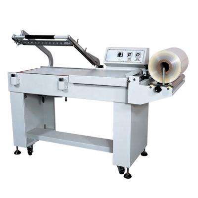 China Semi Automatic Food L Type Films PVC POF Heat Tunnel Shrink Wrapping Box Wrapping Machine for sale