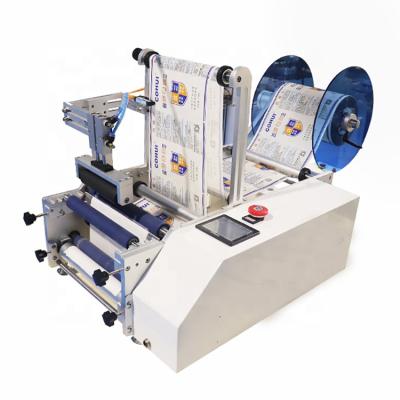 China Food Factory CE Manual Printing Round Bottle Tin Can Sticker Labeling Machine for sale