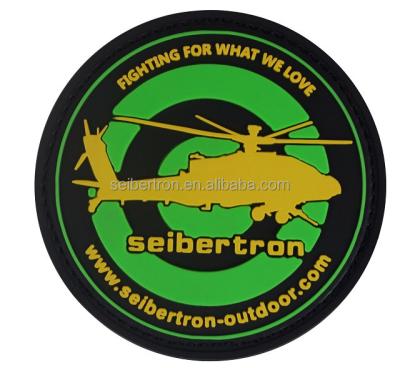 中国 3D Seibertron Helicopter 3D PVC Soft Rubber Patch Military Rubber Badge With Hook Adhesive On The Back 販売のため