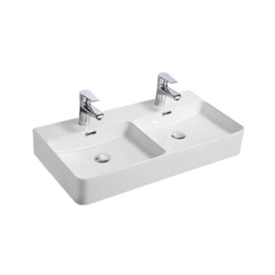 China 2021 New Easy Clean Ceramic Wash Basin Premium Quality Bathroom Double Sinks Wash Basin Model Commercial for sale