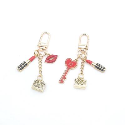 China Casual Fashionable Crystal Lipstick Alloy Mouth Metal Key Chain For Women Girls for sale