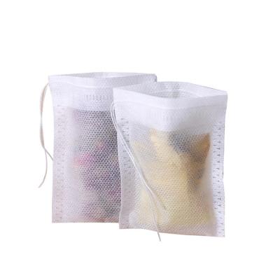 China 100pcs/bag 5*7cm Wholesale Nonwoven Disposable Drawstring Tea Filter Paper Biodegradable Tea Bag for sale