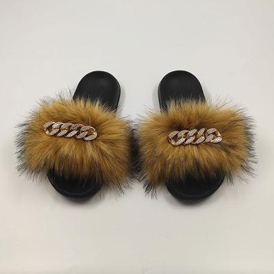 China Quick-drying female raccoon leather slippers with large faux diamond chain sandals wholesale faux fox fur leather fluffy cheap slippers for sale