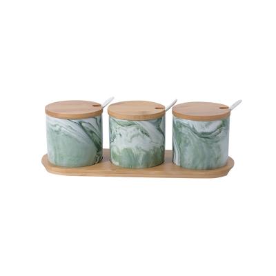 China Sustainable Color Glazed Home Kitchen Storage Jar Ceramic Canisters Marble Design Ceramic Seasoning Canister for sale