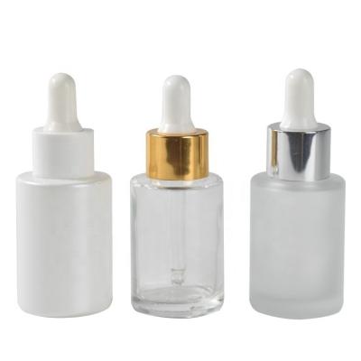 China Personal Care Wholesale 30ml Flat Glass Push Button Pump Cap Shoulder Dropper Essential Oil Dropper Bottle for sale