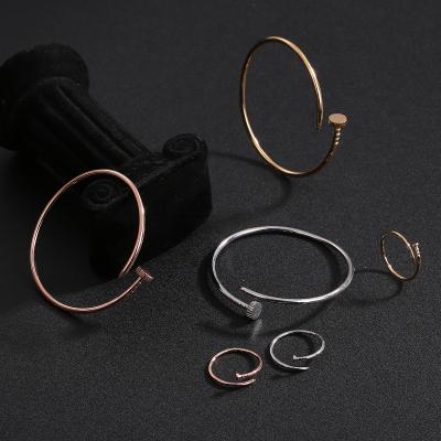 China CLASSIC colorful nail bracelet men and women fashion jewelry set brass adjustable nail bracelet ring set wholesale for sale