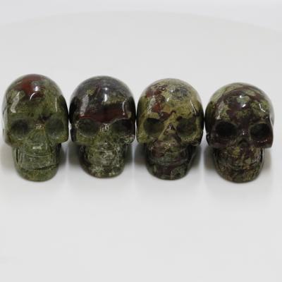 China China Wholesale Skulls Small Dragon Blood Stone Hand Carved Crystal Skulls Bones For Halloween Decoration for sale