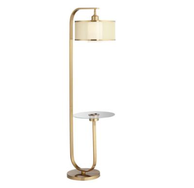 China Modern gold iron floor lamp with shelf and gold trim lampshade for bar for sale