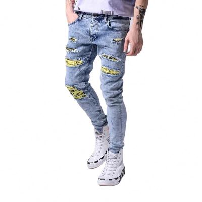 China New Viable Men Streetwear Ripped Jeans Skinny Pants Printed Male Stylish Hop Holes Patches Slim Stretch Denim Pants for sale