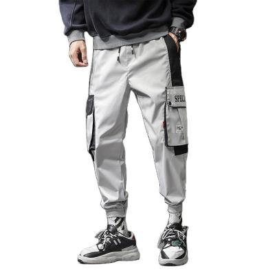 China New Breathable Men Loose Big Feeling Pocket Drop Harem Pants Fashion Handsome Boy Leisure Beam Foot Cargo Pants for sale