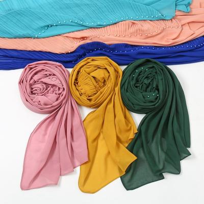 China New Style Women's Chiffon Muslim Chiffon Simple Solid Chiffon Wrap Bubble Hijab Scarf Wrinkle Chiffon Hijab With Beads for sale