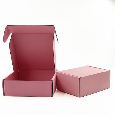 China Custom Materials Recycled Logo Brown Clothing Corrugated Cardboard Packaging Advertisement Box Branded Clothing Pink Shipping Paper Box for sale