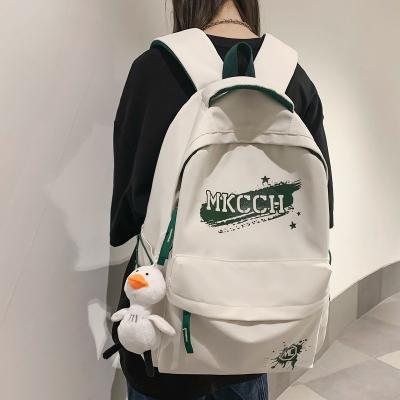 China 2023 wholesale new large capacity school bag leisure cute simple student backpack waterproof add to pendant backpack for sale