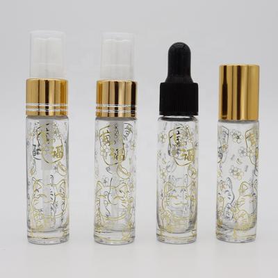 China Essential Oil 10ml Emboss Gold and Silver Lucky Cat Roller Ball Bottle Spray Essential Oil Dropper Bottle for sale