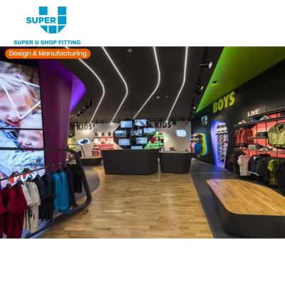 China Exquisite MDF showroom interior decoration layout on sale modern sports clothing store retail sports shop display fixture factory for sale