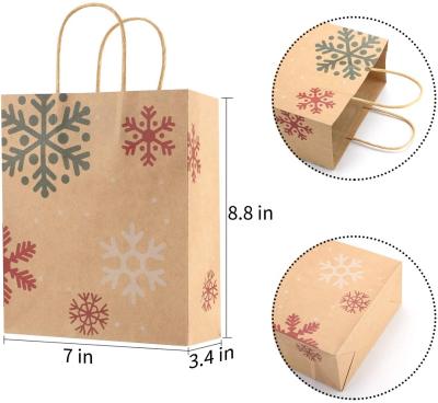 China Recycled Materials Hot Sale Customized Snowflake Printed Kraft Paper Christmas Gift Bag For Christmas for sale