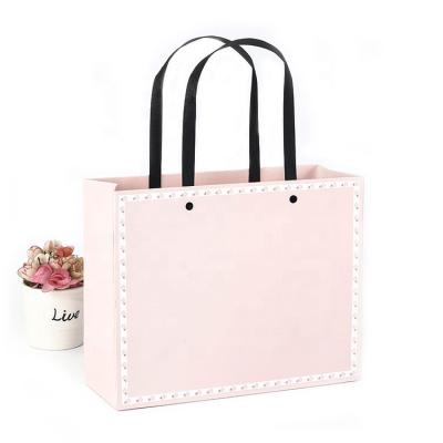 China Custom Recyclable Factory Packaging Gift Box Tote Bag Exquisite Lady Gift Paper Bag Pink Clothing Shopping Bag for sale