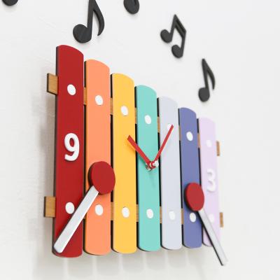 China Modern simple Mandelda style living room home wall clock MDF+polished antique musical notation wholesale acrylic creative clock for sale