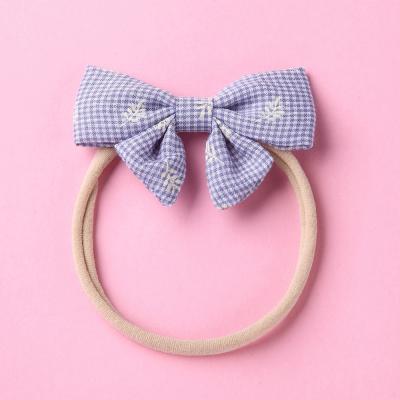 China Hot Selling New Yiwu Children's Fashion Short Hair Bow Fine Hair Band Elastic Nylon Elastic Hair Ties Side Circle Waist Waist Side Crunchies Hair Ties for sale