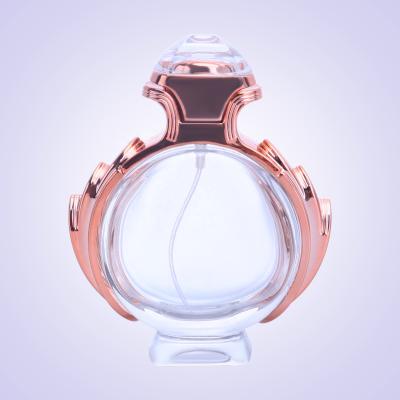 China 100Ml Refillable Bottles 100Ml Empty Luxury Round Glass Cap Gold Pump Sprayer Customized Perfume Bottle for sale