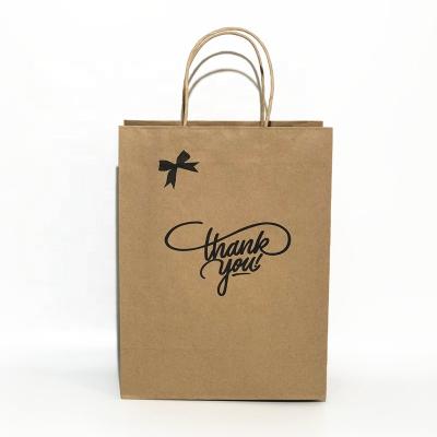 China Disposable Shopping Kraft Paper Bag Custom Paper Printing With Handle For Clothes for sale