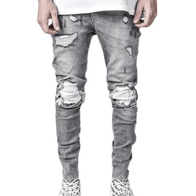 China Anti-wrinkle station European CIA fashion elastic men's denim pants foreign trade border locomotive perforated black jeans men for sale