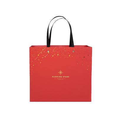 China Recyclable Gold Stamping Paper Bag Gift Custom Shopping Paper Bag With Flat Rivet Handle for sale