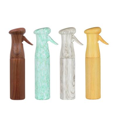 China Hot Sale Four Colors PET Grain Spray Bottle Household Wooden Multi Barber Empty Large Capacity Hairdressing Bottle for sale