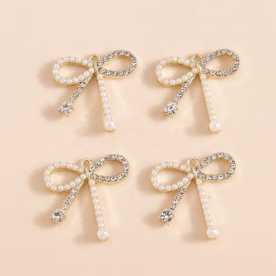 China 4pcs/bag FASHIONABLE Exquisite Crystal Bowknot Charm Imitation Pearl Ribbon Knot Pendants Earrings Bracelets DIY Jewelry Pendant for sale