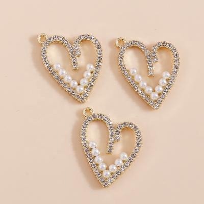 China 4pcs/bag 24*18mm Durable Imitation Pearl Crystal Hollow Love Heart Pendants Charms DIY Jewelry Making Fashion Crystal Pendant Trendy for sale