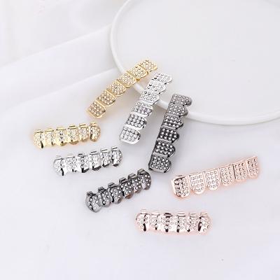 China Hiphop Hip Hop Gold Grillz Teeth Plated Cubic Zircon Rose Gold Vampire Teeth Grillz Cheap Grillz For Men for sale