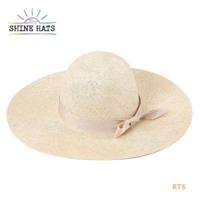 China 2021 Summer Luxury Beach Ribbon Bowknot Grass Sisal Character Design Crown Women's Handmade Straw Hat for sale