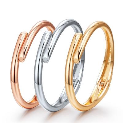 China Other Custom Minimalist Unique Smooth Round Simple Alloy Cuff Spring Bangle Jewelry For Woman for sale