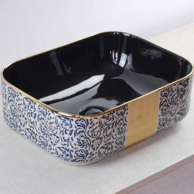 China Easy Clean Luxury Gold And Matte Black Round Ceramic Basin Plated Wash Basin Bathroom Sink for sale