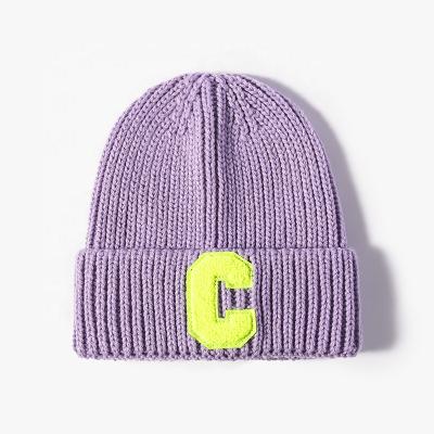 China Women Winter COMMON Plain Beanie Hat With Letter Embroidery Warm Thick Mens Beanies for sale