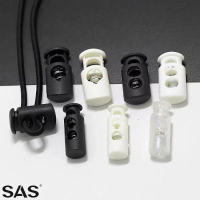 China SAS Logo Plastic Cord Stopper Fashion Nickel Free Engraved Standard High Quality Multicolor Design For Garment for sale