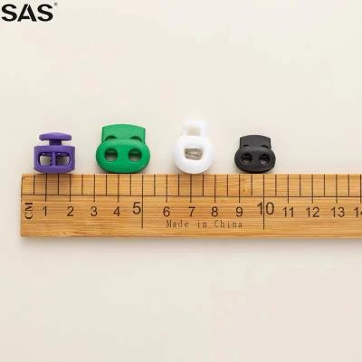 China SAS Nickel Free New Arrival Fashionable Design Custom Engraved Logo Size Colorful Plastic Cord Lock Stopper For Clothing for sale