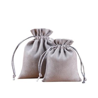 China Junmei Attractive Suede Microfiber Jewelry Drawstring Pouch Customized Logo Pochette Bijoux Luxury Suede Jewelry Bags Drawstring Bag for sale