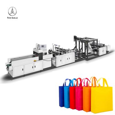 China Eco - Friendly Fully Automatic Two Line Pe Or Nonwoven Material Plastic Apron Rolling Plastic Bag Cutting Machine Plastic Bag On Roll for sale