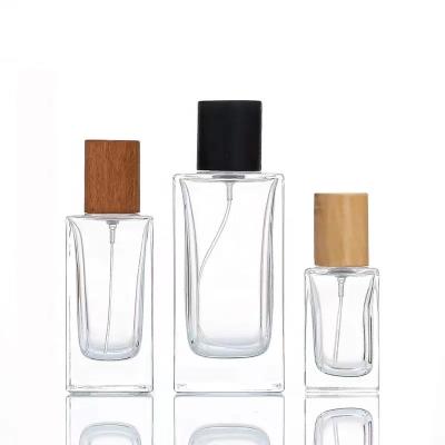 China Perfume Use Hot Selling 30ml 50ml 100ml Square Luxury Empty Colorful Wooden Cap Custom Design Glass Perfume Bottle for sale