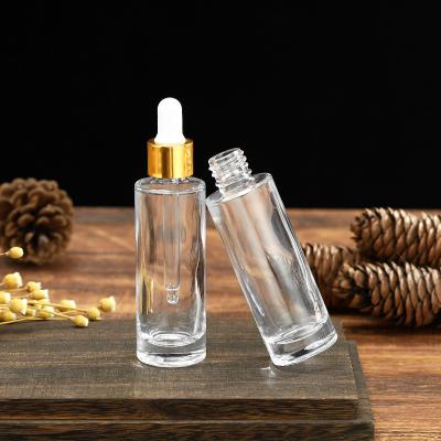 China Wholesale Price Low Price Serum Use Essential Oil 30ml Flat Serum Shoulder Dropper Glass Bottle With Hose for sale