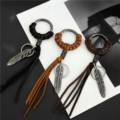 China Retro Zinc Alloy Woven Dangle Key Ring Leather Keychain Motorcycle Harley Feather Lanyard Keychain Net Red Leather Punk Car for sale